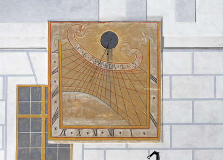 Sundial or sun clock on a wall in Cesky Krumlov castleのeditorial素材