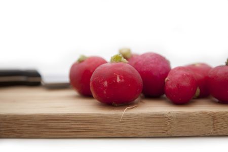 The garden radish and knife on a bamboo board for are sharp vegetablesの写真素材
