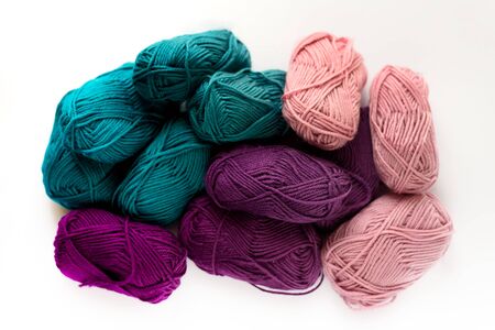 Many colored wool isolated on the white background. Green, purple, pink.の写真素材