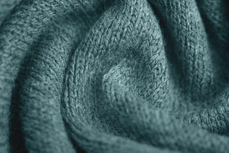 Close up of green knitted textured background. Trendy color.の写真素材
