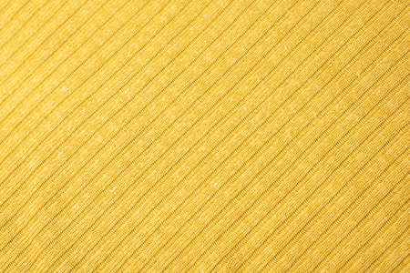 Close up of yellow knitted textured background. Trendy color.の写真素材