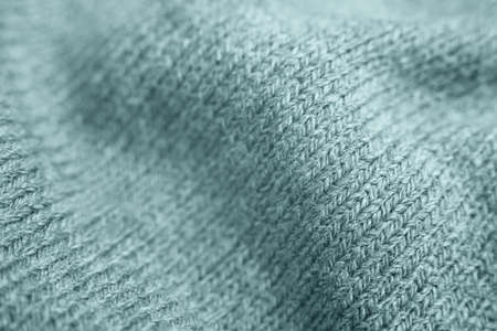 Close up of green knitted textured background. Trendy color.の写真素材