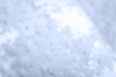 Abstract blurred bright blue beautiful glitter background. Trendy color of the year. Bright and colorful background.の写真素材