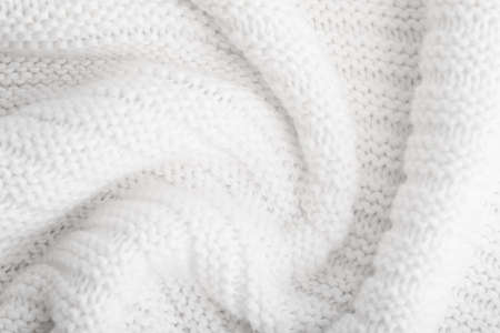 Close up of white knitted textured background.の写真素材