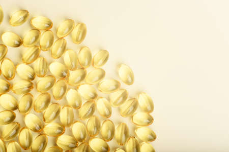 Omega 3 fish oil capsules on the colored background.の写真素材