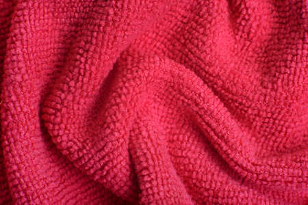 Close up of pink knitted textured background. Trendy color of the year 2022.の写真素材
