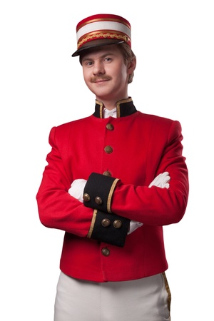 Portrait of a concierge  porter  in a red jacket on a white background  Isolated on whiteの写真素材