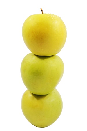 Three ripe yellow apples standing the friend on the friend on the isolated white backgroundの写真素材