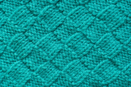 Blue knitted cloth is made by handの写真素材