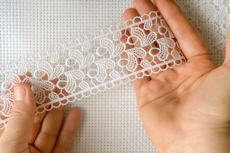 canvas for the embroidery a cross framed by a lace tapeの写真素材