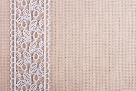 canvas for the embroidery a cross framed by a lace tapeの写真素材