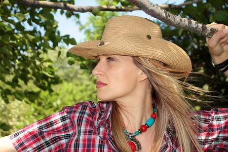 one girl on the nature dressed in western styleの写真素材