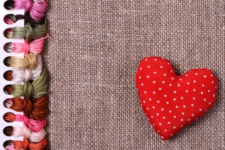 Abstract background of colored threads for cross stitchの写真素材