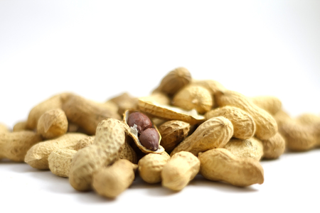 healthy tasty nourishing peanuts isolated on white backgroundの写真素材