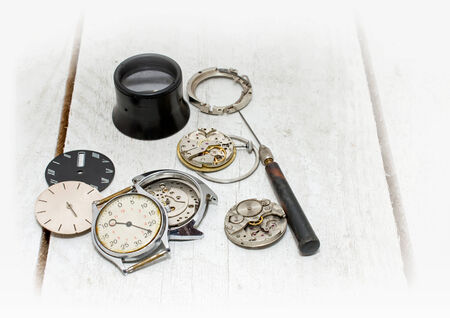 Old clock, parts and repair tools