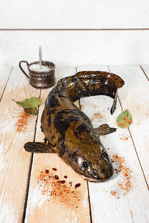 Fresh fish on the kitchen before cutting
