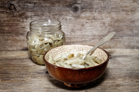 Salted mushrooms on a wooden backgroundの写真素材