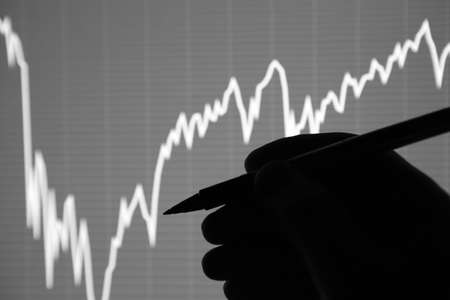 The analysis of the chart of data on the display. Data analyzing in forex market: the charts and quotes on display. Analytics trendsの写真素材