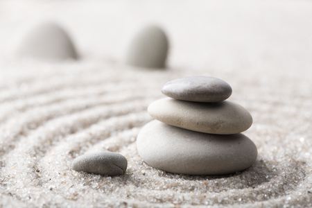 Japanese zen garden meditation stone for concentration and relaxation sand and rock for harmony and balance in pure simplicityの写真素材