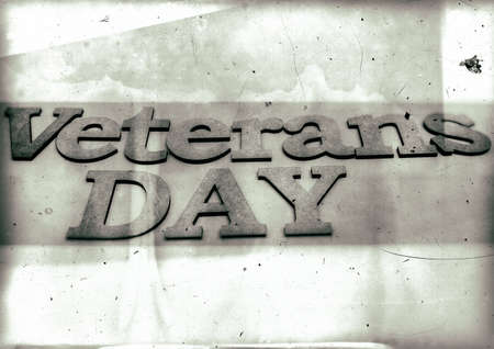 Veterans day banner. Veterans Day inscription stylized background as old bw sepia toned photos.の写真素材