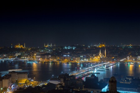 Long exposure cityscape of Istanbul at a night. Galata bridge on Golden Horn gulf. Wonderful romantic old town at Sea of Marmara. Bright light of street lighting and various ships. Istanbul. Turkey.の写真素材