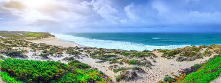 A ocean waves on the beautiful sand beach in at the cloudy stormy day. Breathtaking romantic...