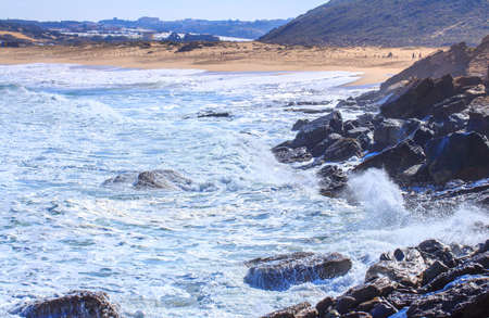 A huge waves on the ocean coast in a shine bright light  at sunny day. Wonderful romantic seascape...