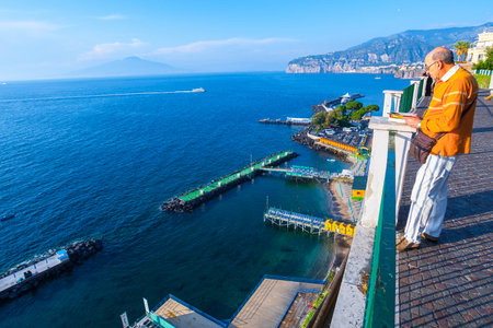 SORRENTO, ITALY - May 29, 2012: Tourists and local residents enjoy at sunny warm evening resting on the sea coast Sorrento, Naples, Campania, Italy.のeditorial素材