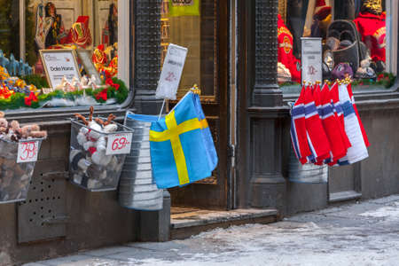 STOCKHOLM, SWEDEN - NOV 26: Christmas atmosphere of the city. National scandinavian flags in souvenir shop. Stockholm. Sweden. Europe. November 26, 2010のeditorial素材