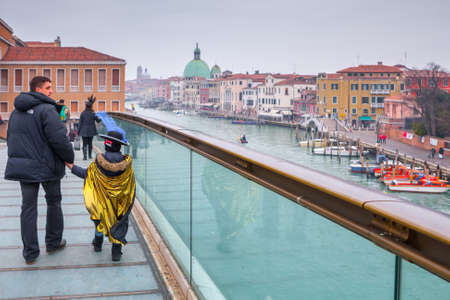 VENICE, ITALY - 19 FEB 2012 - View of the Ponte della Costituzione (constitution bridge), a modern bridge by Santiago Calatrava over the Grand Canal in Venice. Tourists and local on the bridge.のeditorial素材