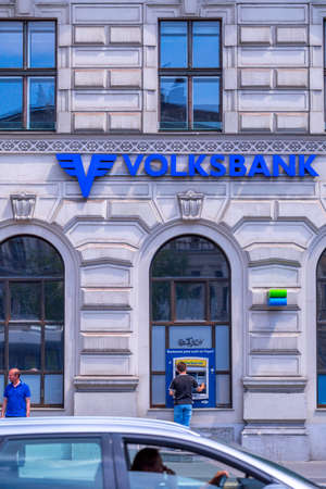 VIENNA, AUSTRIA - MAY 26: Consumers use the services of the bank's ATM. Building of Volksbank Wien AG, on Schottenring 1 in Vienna, on May 26, 2019.のeditorial素材