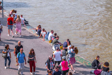 VIENNA, AUSTRIA - MAY 25: Many people are relaxing with alcohol drinks on a day off in a beautiful summer weather on the banks of the Danube Canal(Donaukanal) in Vienna, Austria, on May 25, 2019.のeditorial素材