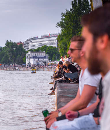 VIENNA, AUSTRIA - MAY 25: Many people are relaxing with alcohol drinks on a day off in a beautiful summer weather on the banks of the Danube Canal(Donaukanal) in Vienna, Austria, on May 25, 2019.のeditorial素材