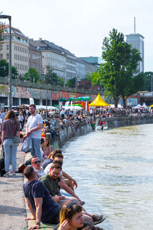 VIENNA, AUSTRIA - MAY 25: Many people are relaxing with alcohol drinks on a day off in a beautiful...