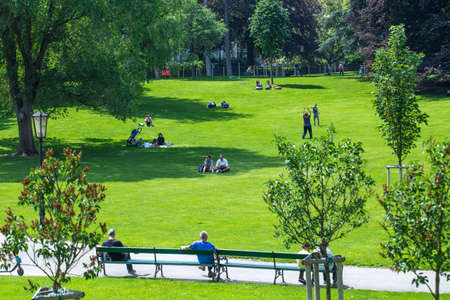 VIENNA, AUSTRIA - MAY 26: People are resting and relaxing in popular public Burggarten park in warm sunny day in Vienna, Austria, on May 26, 2019.のeditorial素材