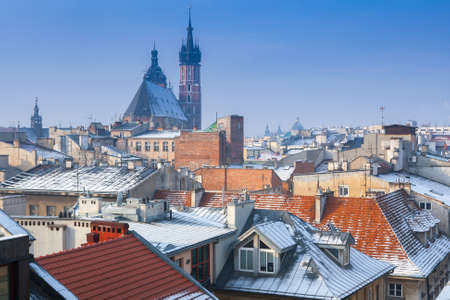 Krakow in Christmas time, aerial view on snowy roofs in central part of city. St. Mary's Basilica on Main Square. Poland. Europe.の写真素材