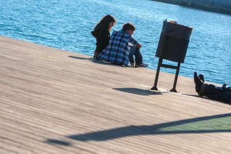 Spain, Barcelona - Jan 01, 2012: People Local and tourists have are rest and relaxing and walk in a...