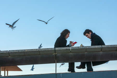 Spain, Barcelona - Jan 01, 2012: People Local and tourists have are rest and relaxing and walk in a...