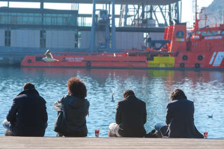 Spain, Barcelona - Jan 01, 2012: People Local and tourists have are rest and relaxing and walk in a...