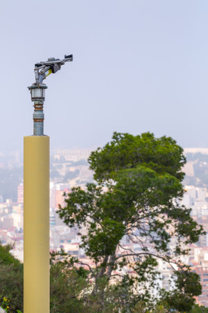 Fire sprinkler with a nozzle valve incorporated. An integral heavy-duty part of the fire protection system of forest or park green flammable plantations in areas with dry and hot climates.の写真素材