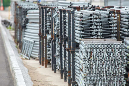 Openair storage of galvanized steel and aluminum frames, ladders, and ringlock scaffolding systems for many applications on restoration, industrial and construction sites.の写真素材