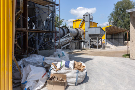 Industrial production of construction mixtures. Tower silos with bulk ingredients. Line for drying and sorting of sand.の写真素材