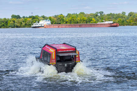 Sherp is a Ukrainian all-terrain amphibious vehicles for rough and soggy terrain. As part of the fun project Sherp carries passengers on the Dnipro River in Kyiv, Ukraine, on August 28, 2019.のeditorial素材
