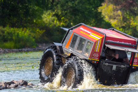 Sherp is a Ukrainian all-terrain amphibious vehicles for rough and soggy terrain. As part of the fun project Sherp carries passengers on the Dnipro River in Kyiv, Ukraine, on August 28, 2019.のeditorial素材