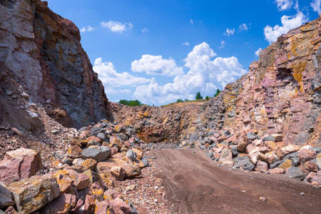 Spectacular view of quarry open pit mining of granite stone. Process production stone and gravel.