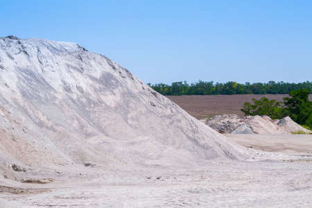 Gravel stone dumps in a quarry open pit mining. Processing plant for crushed stone and gravel. Mining and Quarry mining material.の写真素材