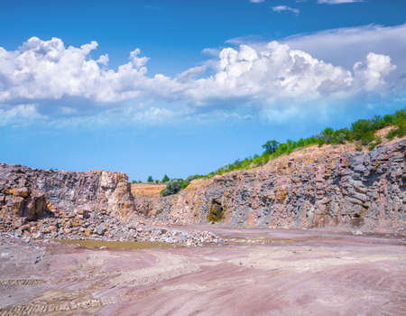 Spectacular view of quarry open pit mining of granite stone. Process production stone and gravel.の写真素材