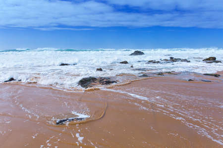 View of Guincho Beach, Cascais, Portugal. Empty beach. No people. Beauty in nature. Waves on the...