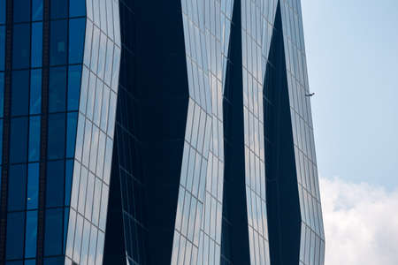 VIENNA, AUSTRIA - JULY 31: A glass facade of building of the DC Tower 1 the tallest skyscraper in Austria(is 220 m high, 250 m including the antenna spire) in Donau city in Vienna, on July 31, 2019.のeditorial素材