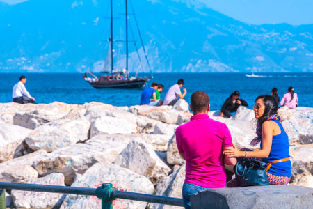 Naples, Italy - may 27: Summer day on the Mediterranean coast. People relax, sunbathe and swim on Mappatella Beach on Quay of Via Francesco Caracciolo. May 27, 2012. Naples, Campania, Italy.のeditorial素材